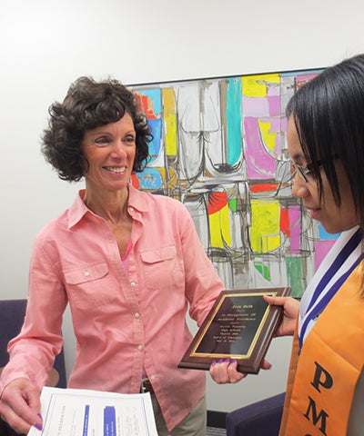 Susan Goldman giving an award