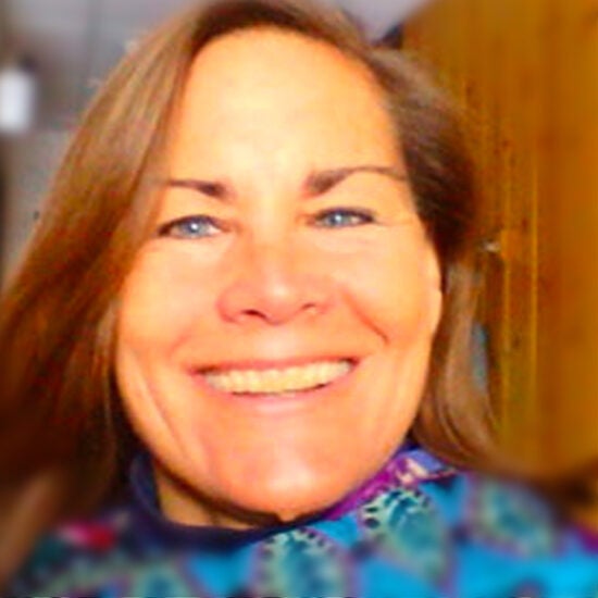 A face with blue eyes and a large smile